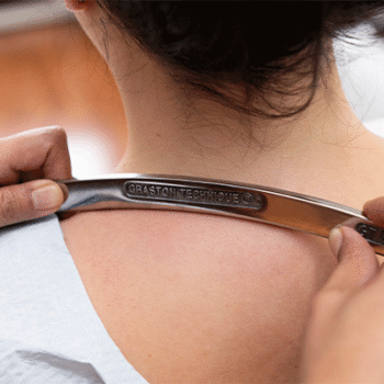 Female patient receiving Graston Technique in Hoboken at Hudson Family Chiropractic
